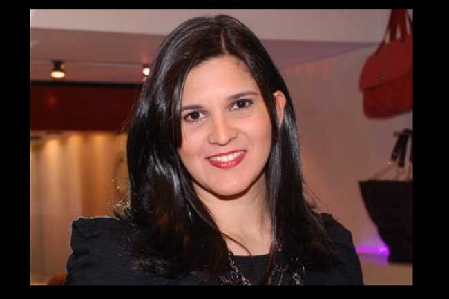 A gerente de marketing do Boulevard, Nadinne Matos rindo com sucesso da campanha com a gigantesca marca Harley Davidson.